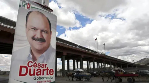 AFP A poster with political propaganda of Chihuahua State Governor candidate, Cesar Duarte from the Institutional Revolutionary Party (PRI) on July 2, 2010, in Ciudad Juarez, Mexico.