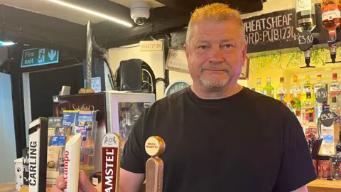 BBC/Julia Gregory John Dennison, landlord of the Wheatsheaf Inn, Bramley