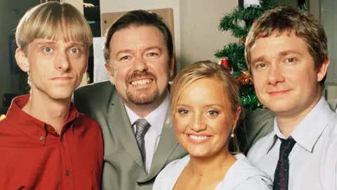 Mackenzie Crook as Gareth Keenan, Ricky Gervais as David Brent, Lucy Davis as Dawn Tinsley and Martin Freeman as Tim Canterbury in The Office