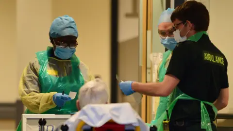 Getty Images NHS staff in PPE gear