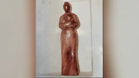 Suffolk Police Wooden figurine of St Margaret holding a lamb which has been stolen from a church