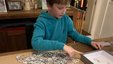 Ceri Anwen James Twm James making a jigsaw