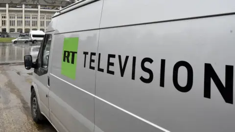 Getty Images A Russia Today (RT) television broadcast van is seen parked in Moscow