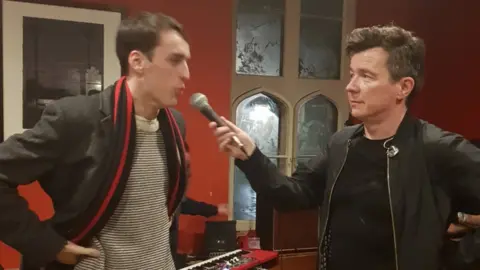 King's College Student Union Student and Rick Astley (right)