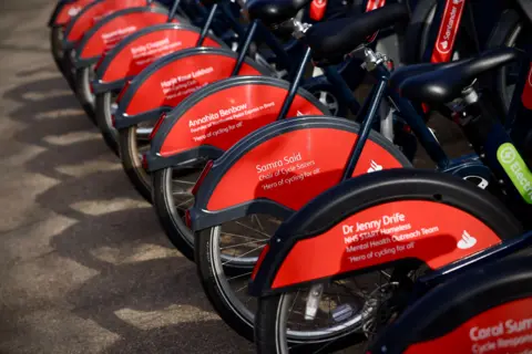 TfL The back wheel of the newly named bike. The name of the inspirational cyclist and the quote "hero of cycling for all" is written on the plastic.