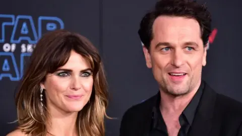  Keri Russell, on the left, and Matthew Rhys attend the Premiere of Disney's "Star Wars: The Rise Of Skywalker" on December 16, 2019 in Hollywood, California