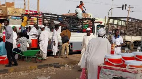 Reuters People flee Khartoum