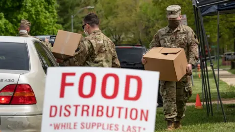 Getty Images national guard members distribute food