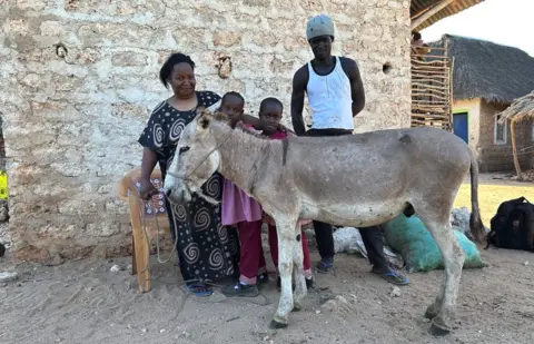 Faith Burden A family with their donkey in Manda village in Kenya