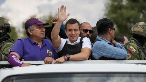 EPA Ecuadorian presidential candidate Daniel Noboa (C), of the National Democratic Action Alliance political movement, drives through the streets of the Ecuadorian capital for the closing of his presidential election campaign in Quito, Ecuador, 11 October 2023.