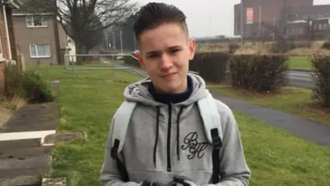 Family handout Jack Woodley wearing a grey tracksuit looks at the camera