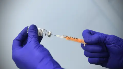 BBC Covid-19 vaccine and syringe