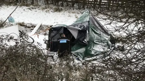 Northamptonshire Police Police officer checking up on a homeless man in Northampton