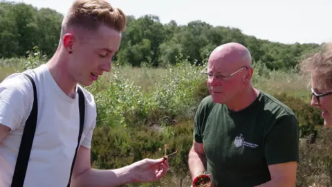 Chester Zoo Joshua Styles (left) with a great sundew seedling