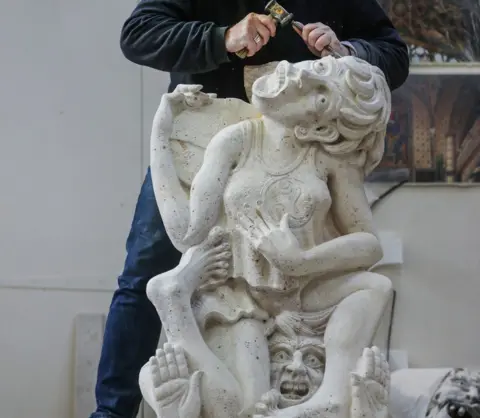 PA Media Cheese-roller gargoyle