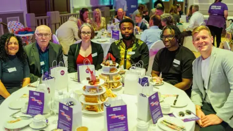 Sylvester Okoli (middle) at the BBC Radio Wiltshire Make A Difference Awards