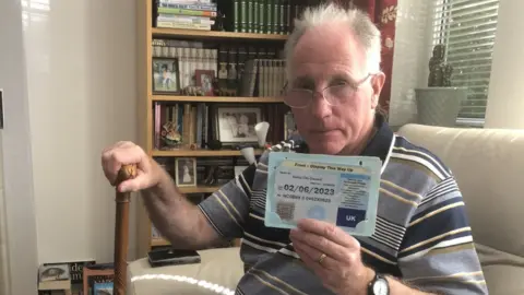 BBC Trefor Jones holding his expired blue badge