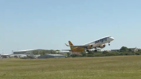 BBC An Aurigny jet plan takes off from Guernsey airport