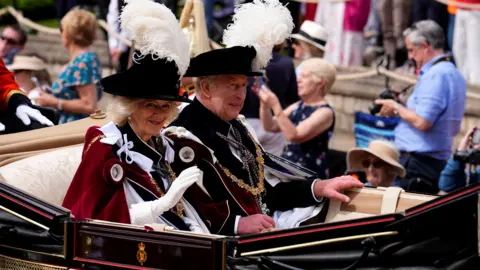 King Charles III and Queen Camilla in a carriage after attending the annual Order of the Garter Service at St George's Chapel, Windsor Castle on 15 June 2026.