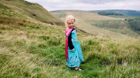 Dan's daughter Megan, aged four at the time, is photographed overlooking the Bwlch mountain