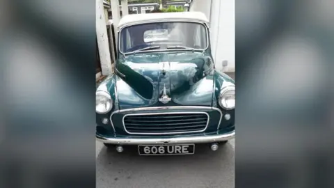 Handout A black 1958 Morris Minor Convertible