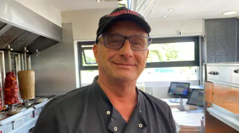 Andreas Symeou stood inside Shelton Lock Fish Bar
