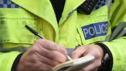 PA Media Generic police officer