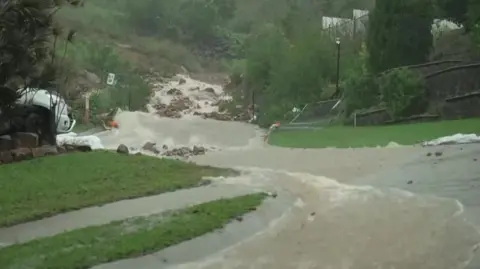 Reuters Fast running water down a hill close to Townsville in northern Queensland