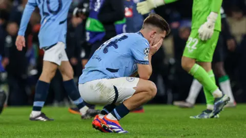 Manchester City's players react after their side's 3-3 draw against Feyenoord