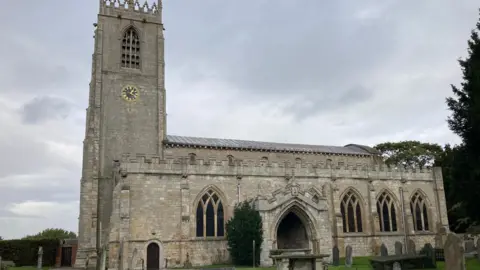 Graham Robinson St Mary and St Martin's Church, in Blyth, a traditional looking church, viewed from the side
