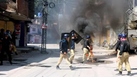 EPA Police clash with demonstrators during a protest against the arrest of committee leaders and activists in overnight raids in Muzaffarabad, Pakistan, 11 May 2024