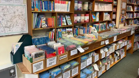 Shelves filled with an array of maps
