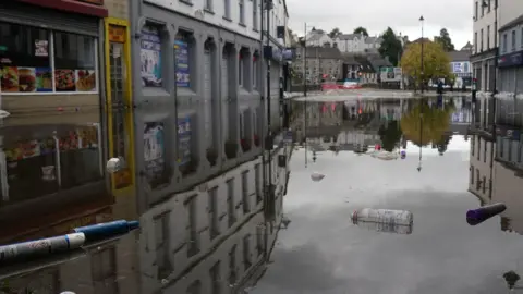 PA A view of debris and flood water in Sugar Island as the clear up begins in Newry 