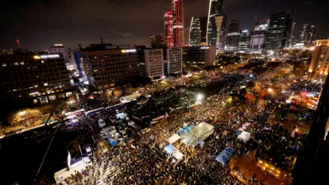 Reuters Protesters take part in a rally calling for the impeachment of South Korean President Yoon Suk Yeol, who declared martial law, which was reversed hours later, near the National Assembly in Seoul, South Korea, 