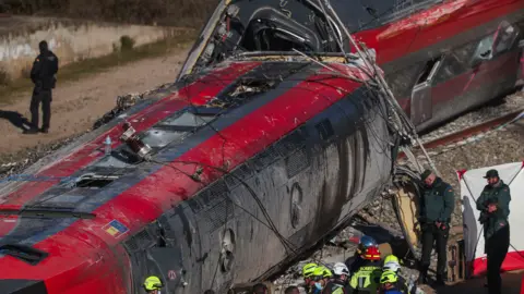GUARDIA CIVIL HANDOUT/EPA A screen grab from a video made available by the Spanish Civil Guard shows agents gathering evidence at the site of the wreckage where, on 18 January 2026, at least 39 people died