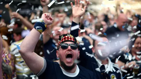 Getty Images A Scotland fan in shades cheers