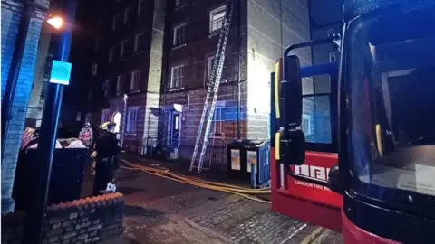 LFB Ladders outside a flat fire in Whitechapel