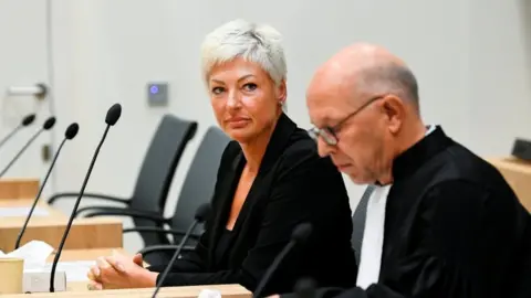 Reuters Ria van der Steen and her lawyer in the courtroom