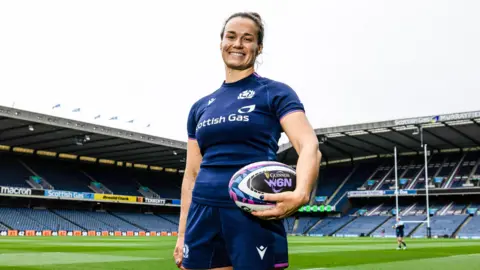 Scotland captain Rachel Malcolm poses for photos at Murrayfield
