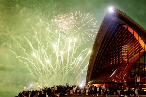 Brook Mitchell/Getty Images he Sydney NYE fireworks seen from the Sydney Opera House on January 01, 2025 in Sydney, Australia.