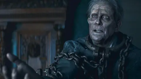 Christmas Karma A picture of Hugh Bonneville as a ghost in Christmas Karma