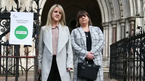 PA Media Former sub postmasters Janet Skinner (left) and Tracy Felstead outside the Royal Courts of Justice, London.