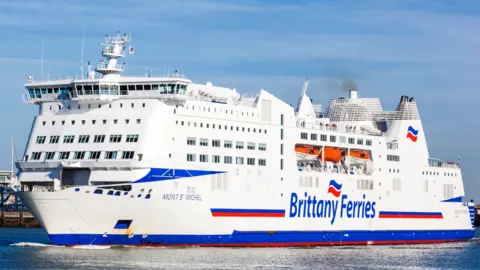 A white ferry with "Brittany Ferries" written on the side.