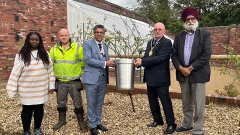 Sandwell Council Sandwell mayor Bill Gavan and councillors stand to receive the award