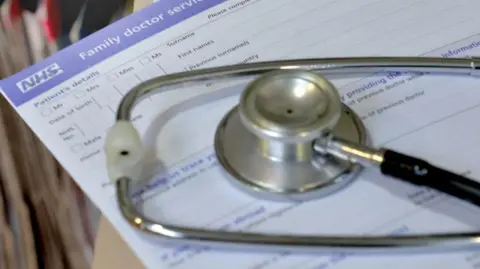 Anthony Devlin/PA Wire Stethoscope on NHS document