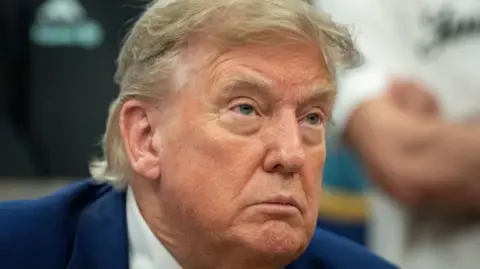 Image shows a close-up of US President Donald Trump 