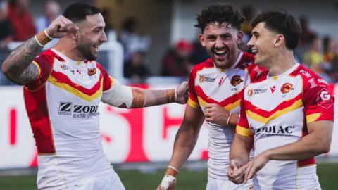 Catalans celebrate a try