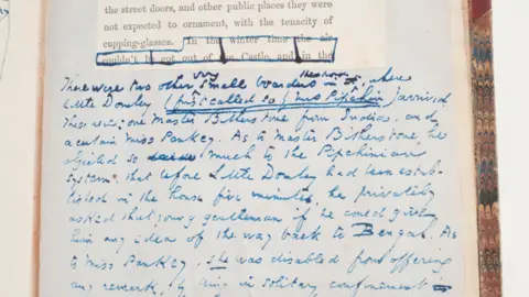 Charles Dickens Museum A page from a copy of Dombey and Son showing Charles Dickens' own extensive handwriting.