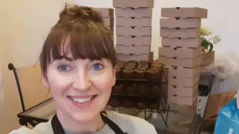 Ros Paterson Ros Paterson in front of her boxes of bakes