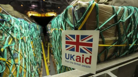 Crown Copyright UK Aid in an aircraft